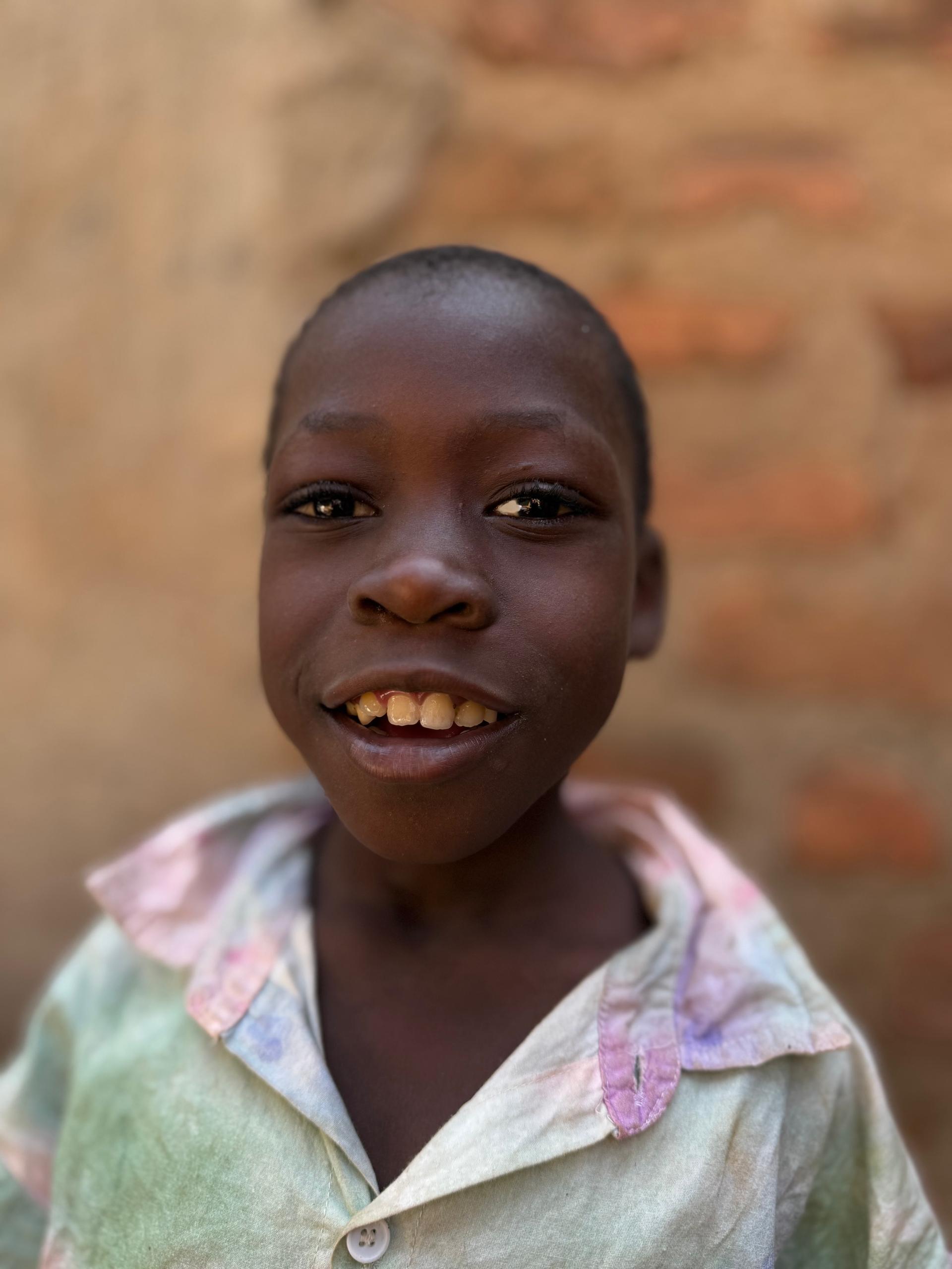 Gilisom, one of the children at Above Uganda Ministries, smiling